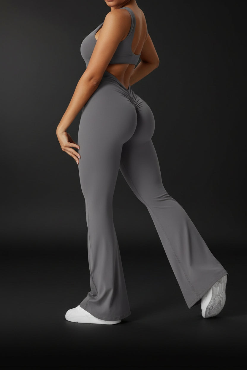 Gray jumpsuit worn by a person on a white background