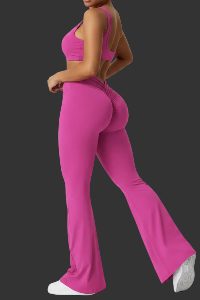 Person wearing a pink jumpsuit on a white background